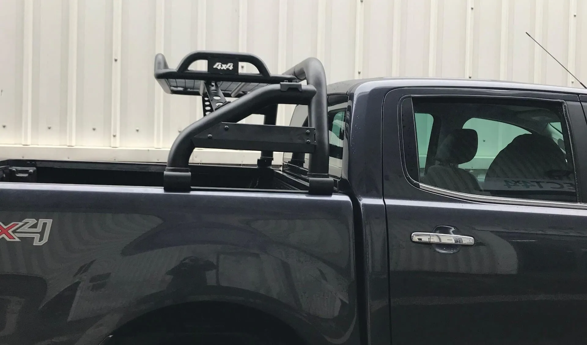 Black SUS201 Short Arm Roll Bar with Cargo Basket Rack for the Ford Ranger 06-12